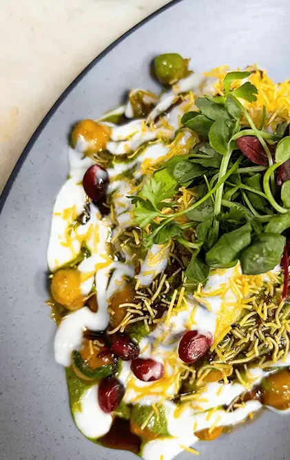 Chaat with yogurt, chutney, sev and fresh herbs