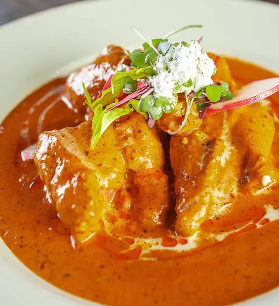 Creamy orange curry with chicken pieces
